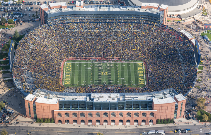 Aerial photo of Michigan Stadium, October 2016, with over 107,500 seats. The number of Americans projected to lose health insurance by 2018 would fit this stadium 130 times.