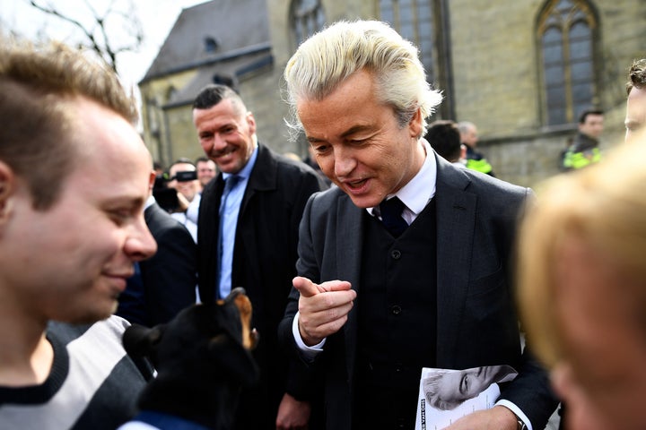 Dutch far-right politician Geert Wilders of the PVV party reacts as a dog barks at him as he campaigns in Valkenburg, Netherlands, on March 11.