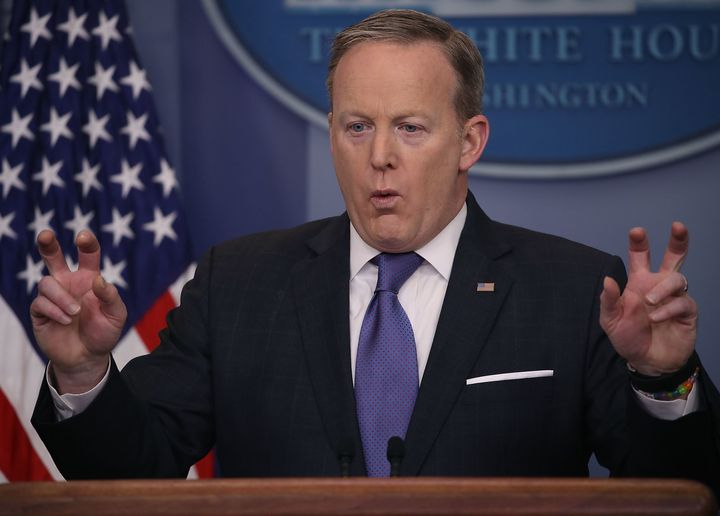 White House press secretary Sean Spicer on Monday used air quotes to signify that Trump did not necessarily mean "wire tapping."
