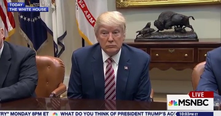 The President sits passively silent while reporters pepper him with questions on March 10, 2017.