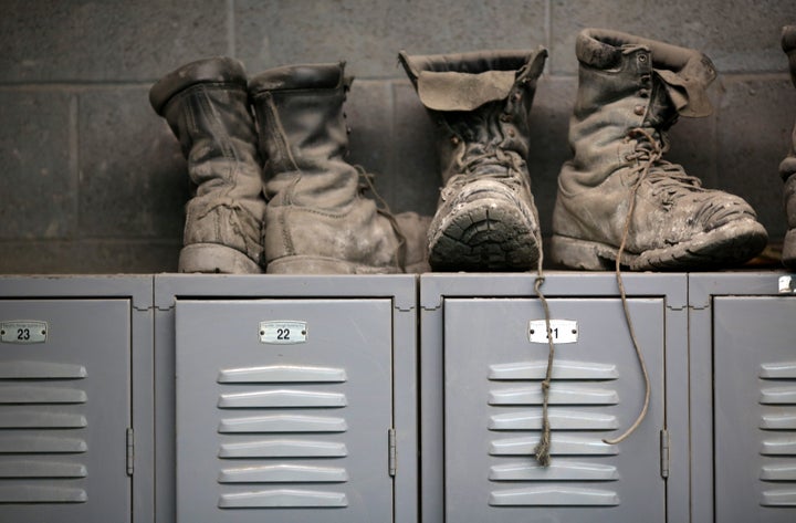 Miners' boots sit atop their lockers before the start of an afternoon shift at a coal mine near Gilbert, West Virginia.