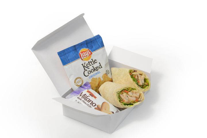 What could be in that wrap sandwich box? Milano cookies and Lay's potato chips.