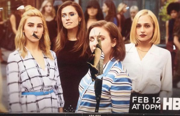 A vandalized advertisement in New York City for the final season of <em>Girls</em>.