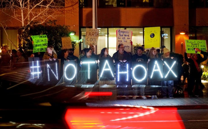 Protesters chant during a rally against climate change in San Diego, California, on Feb. 21, 2017.