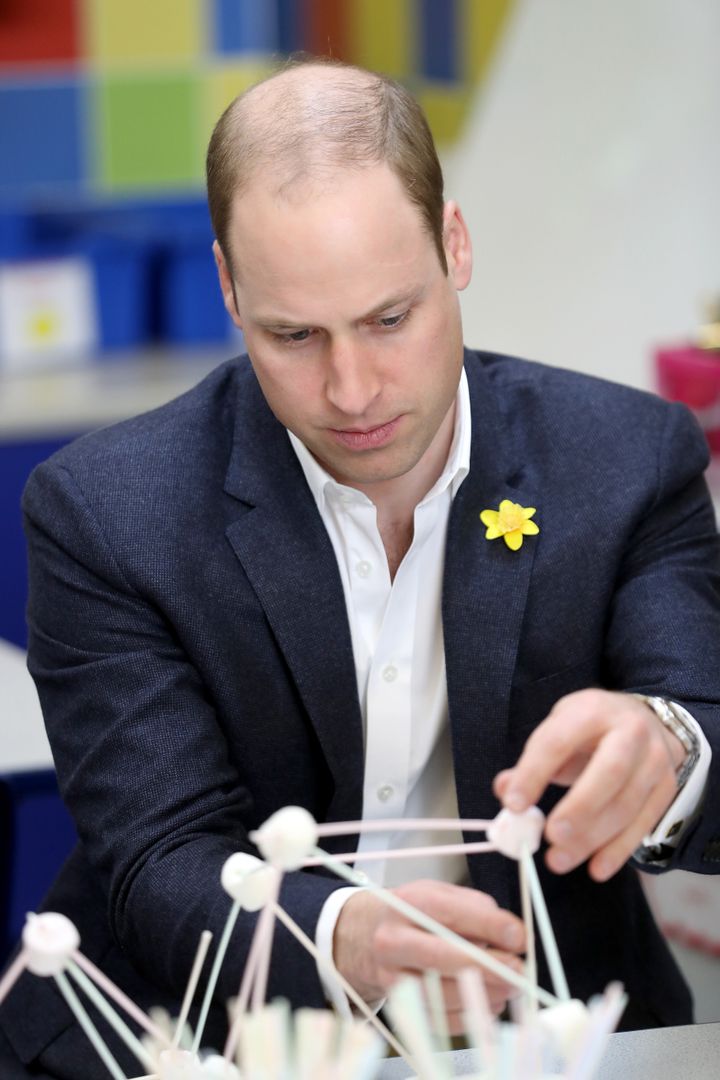 Prince William helps children complete a construction task as he launches the new Prince William Award with SkillForce on March 1, 2017 in Abergavenny, Wales