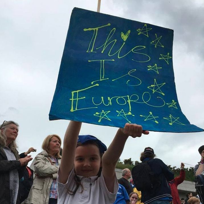 Cissy, Jim Fraser's nine-year-old daughter, holds her placard at a demonstration outside the Scottish Parliament