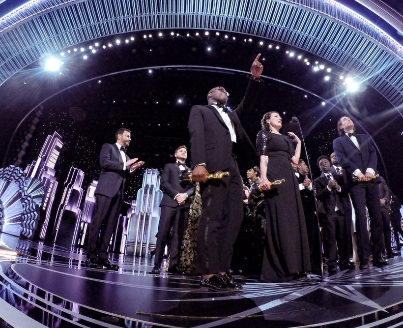 After the debacle: Adele Romanski, Berry Jenkins, and Jeremy Kleiner accept the Oscar for Best motion picture of the year, fo
