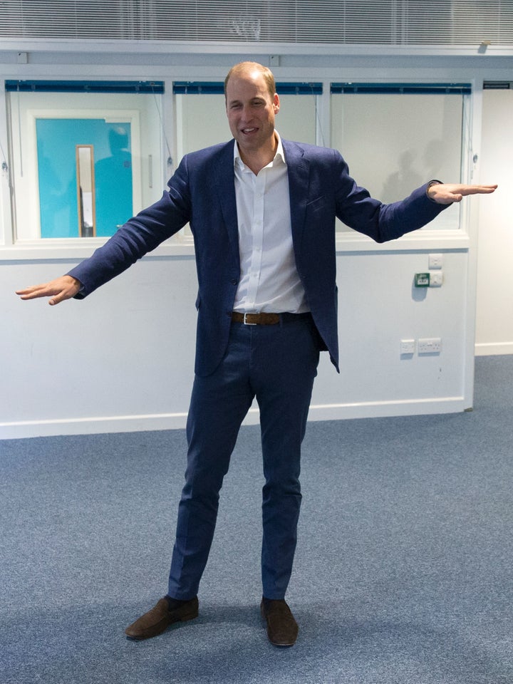 Prince William learns another dance move with Scariofunk dance collective during a visit to Caius House Youth Centre in London on September 14, 2016.