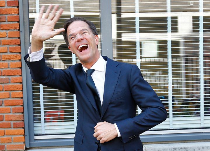 Dutch Prime Minister Mark Rutte of the VVD waves after voting in the general election.