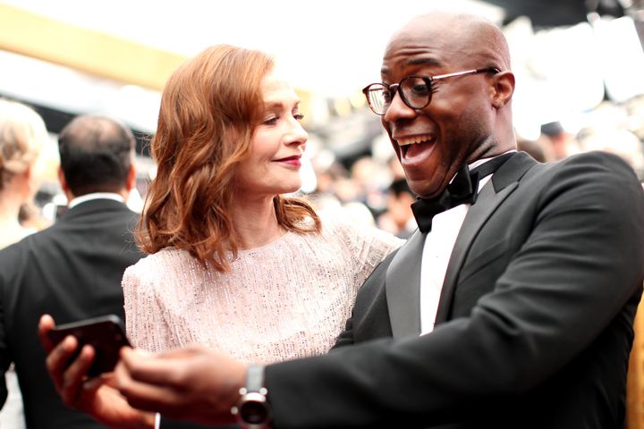 Isabelle Huppert and "Moonlight" director Barry Jenkins on the red carpet at the Oscars on Feb. 26, 2017.