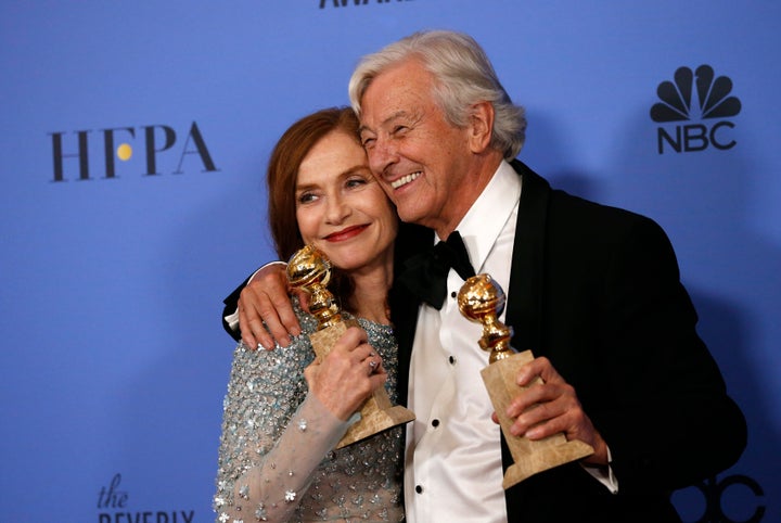 Isabelle Huppert and "Elle" director Paul Verhoeven backstage at the Golden Globes on Jan. 8, 2017.