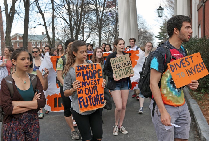 Students and alumni calling for divestment at Tufts University in Medford, Mass., in 2015. The divestment movement began in 2011 on the campuses of U.S. universities and colleges.