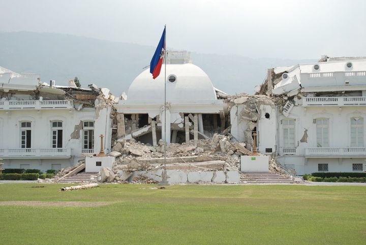 <p><em>Haiti's Presidential Palace weeks after the January 2010 earthquake that killed up to 350,000. The resulting cholera epidemic continues to kill over 10,000 at last reports. To me this is symbolic of 200 years of foreign occupation of Haiti and what it wrought. This building is gone now, and and an opaque green fence surrounds the Presidential grounds.The people cannot see what does not remain.</em></p>