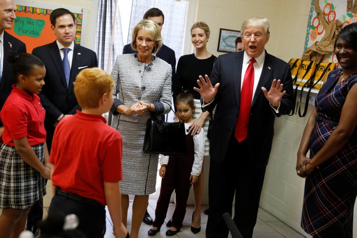 President Donald Trump, joined by Florida Gov. Rick Scott (R), Sen. Marco Rubio (R-Fla.), Education Secretary Betsy DeVos, daughter Ivanka Trump and granddaughter Arabella Kushner, visits Saint Andrew Catholic School and Principal Latrina Peters-Gipson in Orlando, Florida, on March 3, 2017.