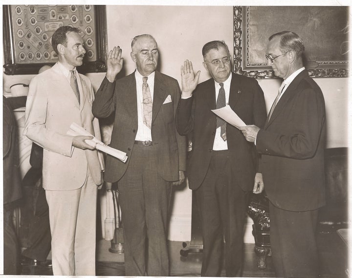 W. W. Durbin (third from left) being sworn-in. Dean Acheson as witness (far left). 1934