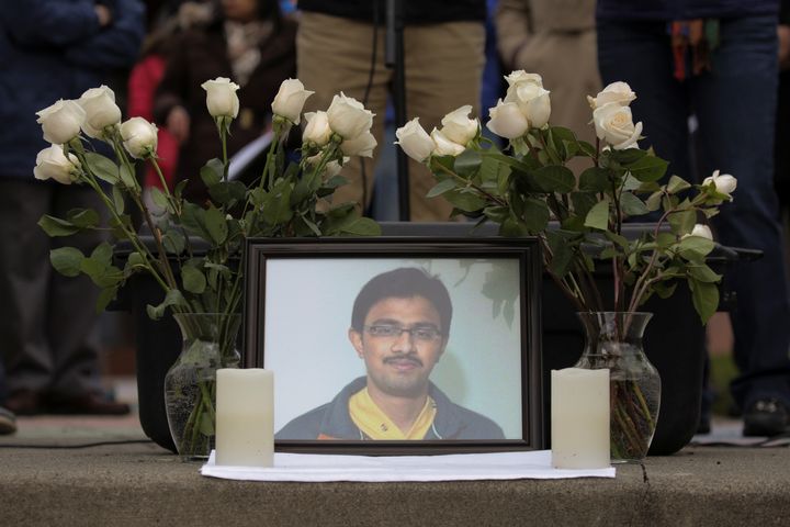 A picture of Srinivas Kuchibhotla, an immigrant from India who was recently shot and killed in Kansas, is surrounded by roses during a vigil in honor of him at Crossroads Park in Bellevue, Washington, U.S. March 5, 2017.