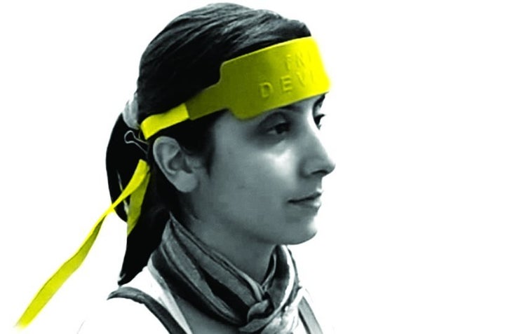 The new headband was designed to measure how much a person’s brain is syncing up with someone else’s (and thus, how well two people are communicating).