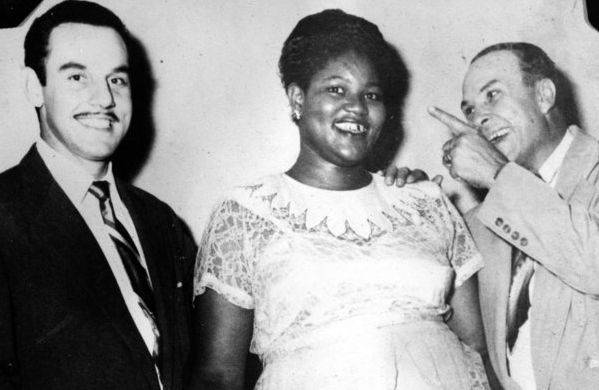 CIRCA 1950: Band leader Johnny Otis poses for a portrait with "Big Mama" Willie Mae Thornton and Peacock Records executive Don Robey.