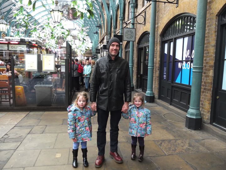 Martin Hughes with his twin daughters
