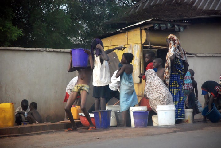 Lagos residents buying water. Activists, unions, community leaders and members of the public have thus far been successful in resisting the introduction of public-private partnerships to the city's water sector. 