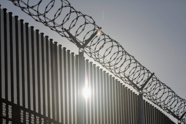 HIDALGO, TX - MARCH 14: The border fence between the United States and Mexico stands at an international bridge between the t