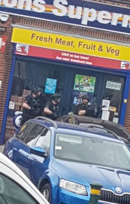 Armed police outside the NatWest branch.