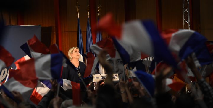 French far-right Front National party candidate Marine Le Pen stands on stage this week