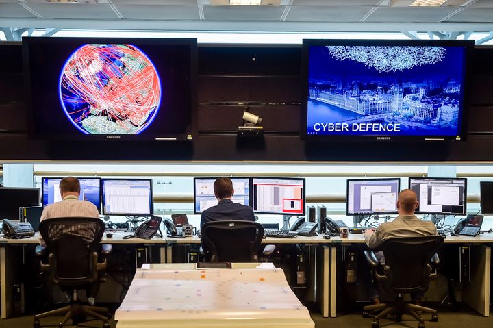 People sit at computers in the 24 hour Operations Room inside GCHQ, Cheltenham in Cheltenham, November 17, 2015.