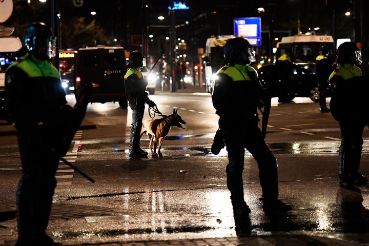 Riot police stand guard during clashes with demonstrators near the Turkish consulate in Rotterdam, Netherlands. March 12, 2017.