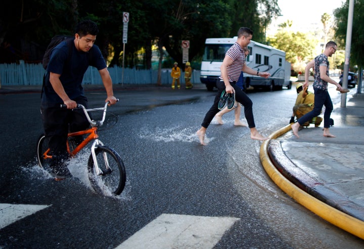 A major water main ruptured and flooded Sunset Boulevard in Los Angeles in 2014. Crises like these are becoming increasingly common and little funding is available to address the issue.