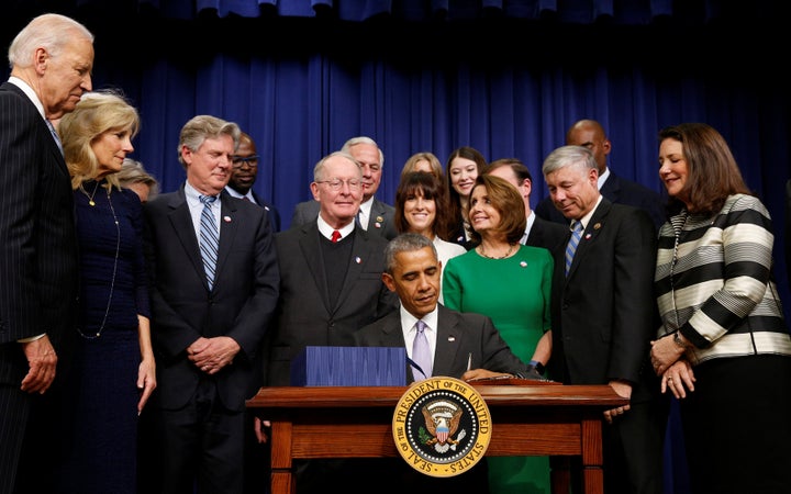 Former President Barack Obama signs the 21st Century Cures Act at the White House in Washington, D.C., on Dec. 13, 2016.