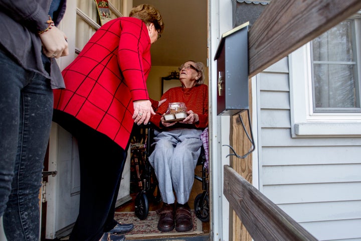 Nancy Brennerman, center, makes a Meals on Wheels delivery to Josephine Hayward, 93, of Portland, Maine, on Christmas Day 2015.