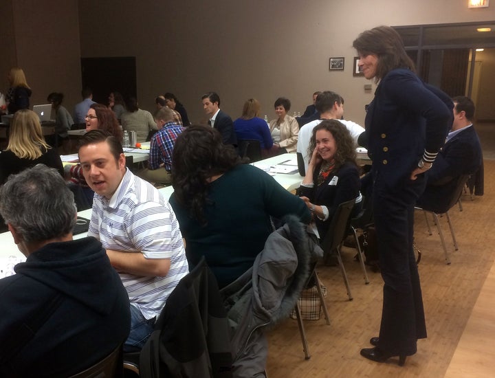 Bustos checks in on her Build the Bench participants during a breakout session, like a proud mother hen.