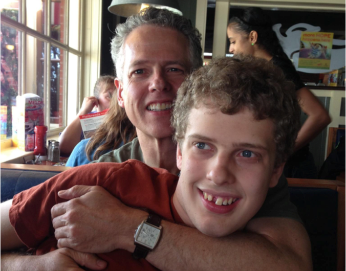 Luke, pictured here with his father Jeff Perkins, was at the center of a disability rights case.