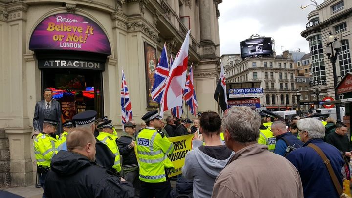 Britain First members protected by police during the March Against Racism