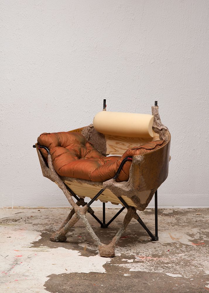 Jessi Reaves, Crust Bucket Comes to Town (Slipper Chair), 2016, steel frame, pine, studio dust, wood glue, polyurethane foam, cotton, silk, plywood, nylon, cording, and hardware, 36 x 38 x 38 in. (91.4 x 96.5 x 96.5 cm). Courtesy the artist and Bridget Donahue, New York.