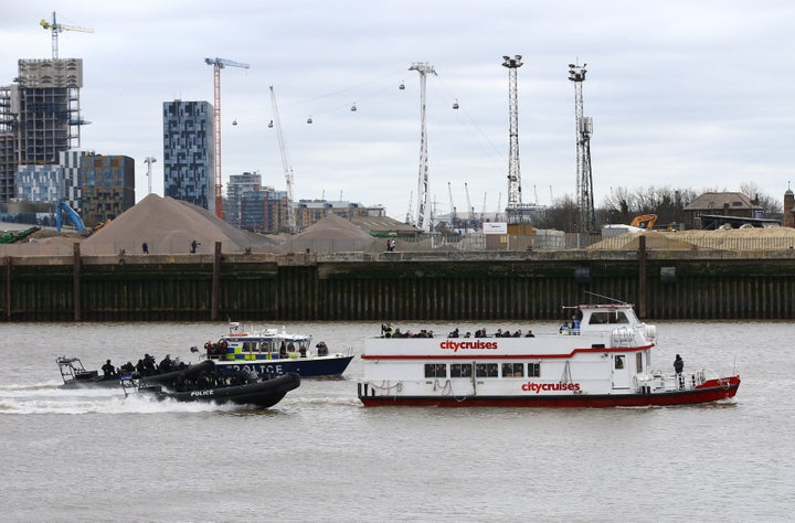 Police officers taking part in a multi-agency exercise, which will test the emergency services' response to a marauding terrorist attack in London, on the river Thames in east London.