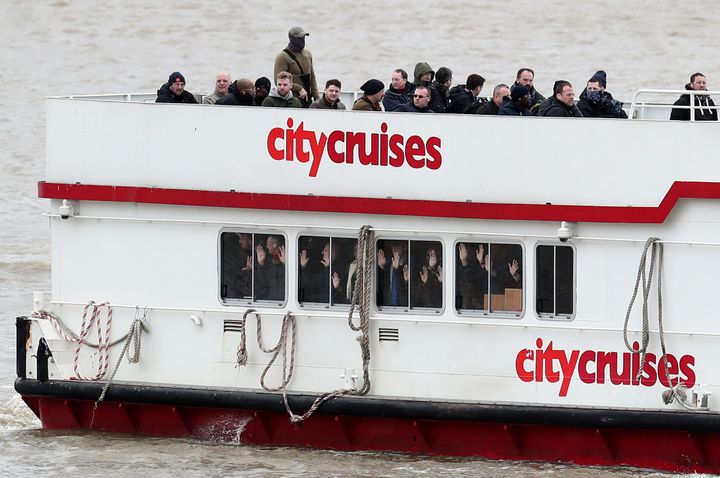 People with the hands up in a boat during a multi-agency exercise, which will test the emergency services' response to a marauding terrorist attack in London, on the river Thames in east London.