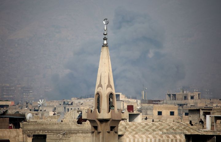 Smoke billows following a reported air strike in the rebel-held parts of the Jobar district, on the eastern outskirts of the Syrian capital Damascus. 