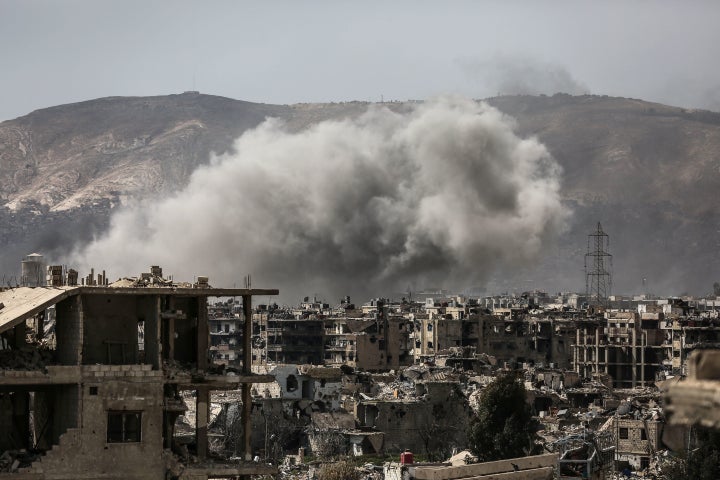 Smoke billows following a reported air strike in the rebel-held parts of the Jobar district, on the eastern outskirts of the Syrian capital Damascus. 