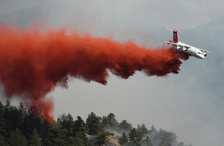 Fire crews fight a wildfire from the air in Sunshine Canyon.