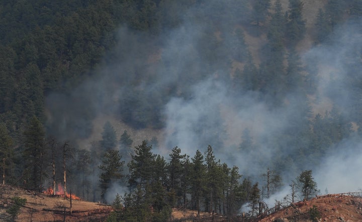 Fire crews work a wildfire in Sunshine Canyon.