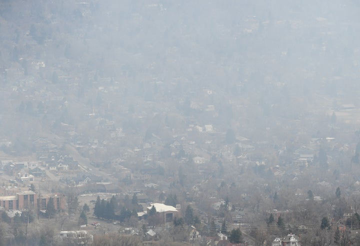 Smoke covers Boulder as a wildfire burns near Sunshine Canyon.