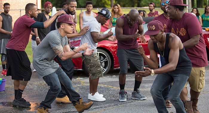 In a scene from Burning Sands, Netflix, Inc.’s newest original movie, brothers of a Greek-letter organization recite their fraternity’s signature chant.