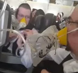 The clip shows passengers putting on their oxygen masks as the plane prepared to make an emergency landing 