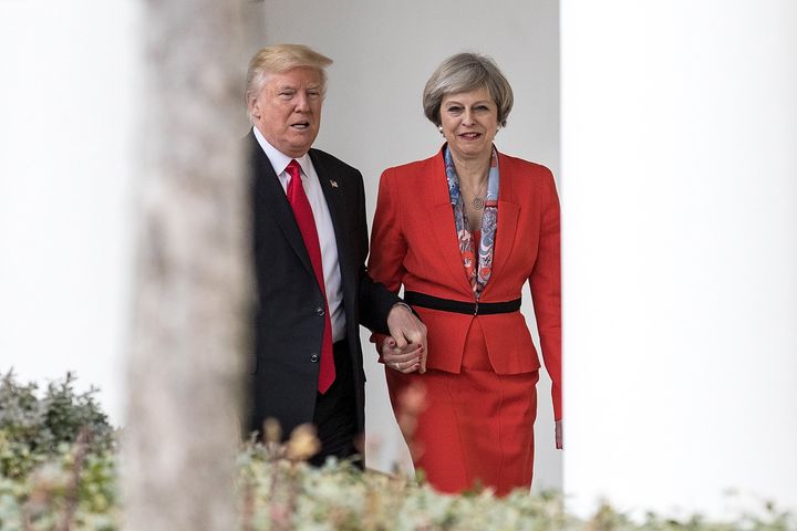 Theresa May and Donald Trump walk along The Colonnade of the West Wing at The White House in January.