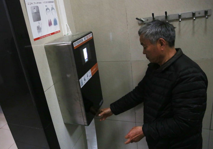The machine recognizes a man's face to give out toilet paper automatically at a toilet in the park of the Temple of Heaven in Beijing, China.