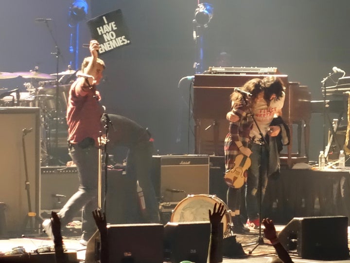 <p>Bob Crawford (with sign), Tania Elizabeth, and Seth Avett, Roanoke, Virginia (November 18, 2016).</p>