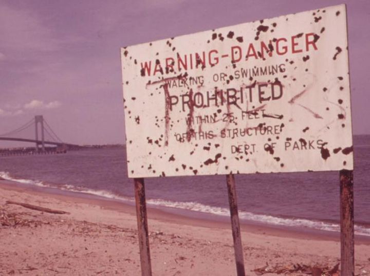 Sign warning of polluted water on Staten Island Beach, June 1973.