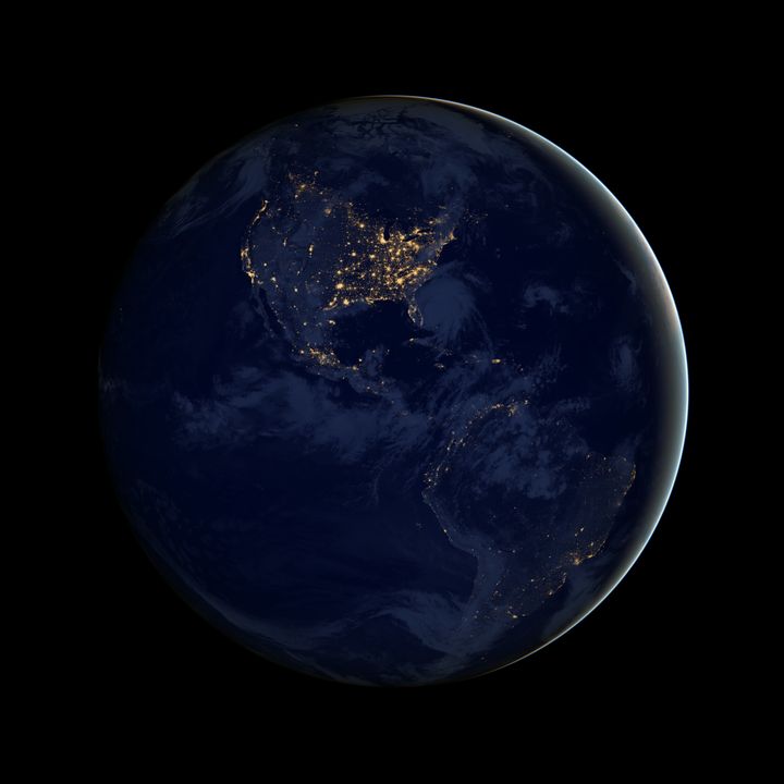 A composite image of North and South America at night assembled from data acquired by the Suomi NPP satellite in April and October 2012.